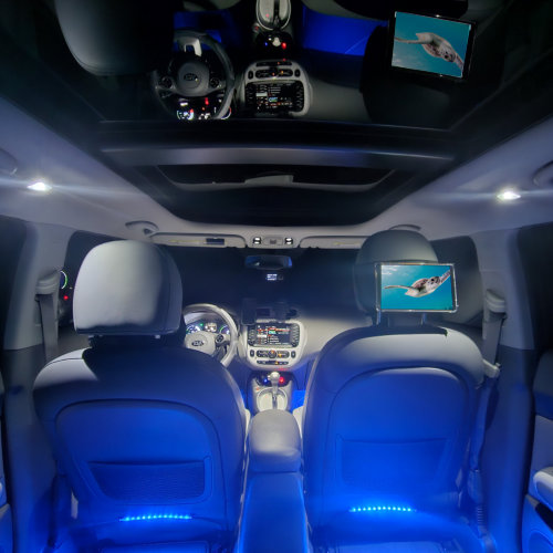 The backseat interior of the fully loaded KIA Soul EV+ with leather interior, panoramic moonroof, custom interior lighting, and premium sound system.